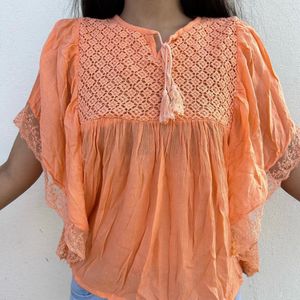 Beautiful Orange Top With Unique Hand Design