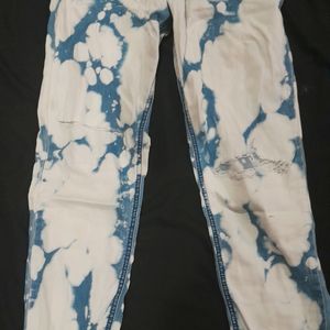 Ripped Cow Print Jeans