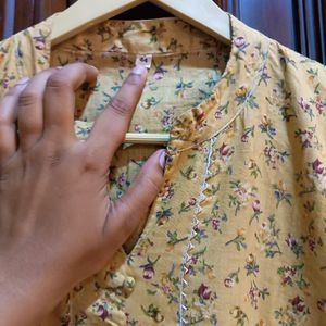 Yellow kurta with a delicate, small floral Print.