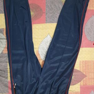 Navy Blue Lower or Traking pants with chain detailing pockets at front and back. elasticated and also have drawstrings on the waist