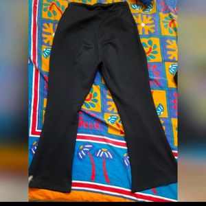 Black flared pants with elastic in waist.