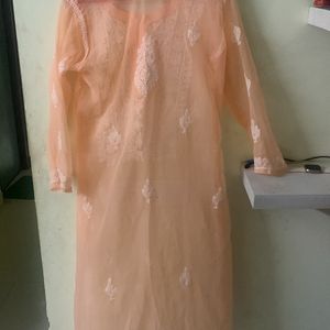 Peachy Orange Transparent Chikankari Kurti With inner