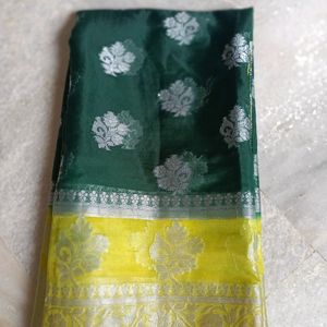 A Bottle Green Colour Saree With Yellow Border