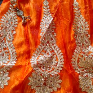 Selling Lehnga With Orange And Golden Colour