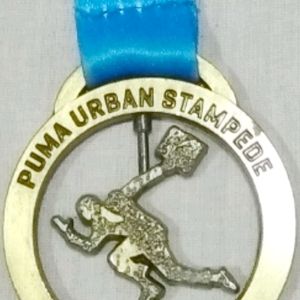 Collectible PUMA Urban Stampede Finisher Medal.