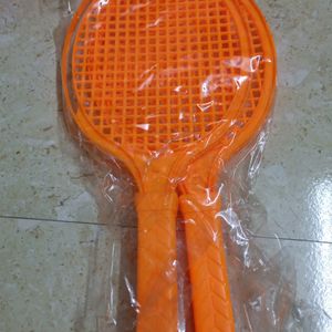 Two Toy Rackets And Shuttle Cock