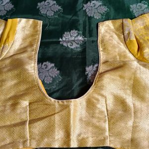 A Bottle Green Colour Saree With Yellow Border