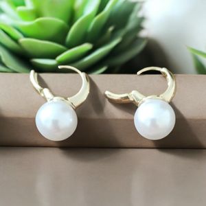 White Pearl Earings.