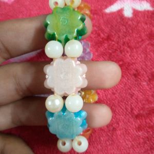 Multicolored Lotus Shape Bracelet With White Beads