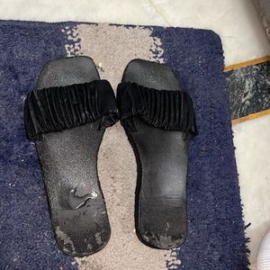 Black slippers