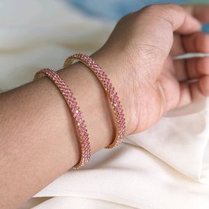 A Rose Gold Bangle With Ros Stones