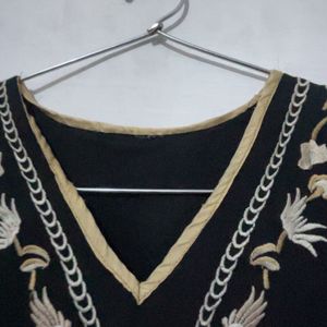 a black embroidery crop top