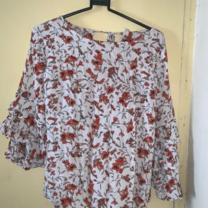 white and orange floral top