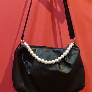 Black Sling Back With Pearl Strap Attachment