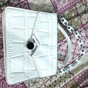 white hand purse