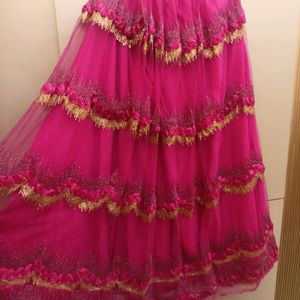 golden choli and dark pink ghaghra with duppatta