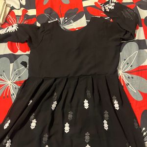 A Short Black Kurti With Work Of White Chikankari