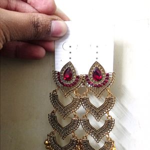 Beautiful red golden colour long jhumka earrings