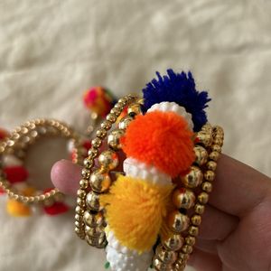 golden bracelets with pompom