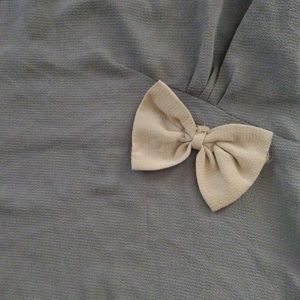 GREY TOP WITH BOW OVER WAIST