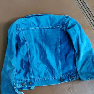 blue denim jacket with open buttons
