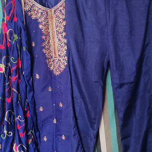 This suit features a rich, deep blue Fabric