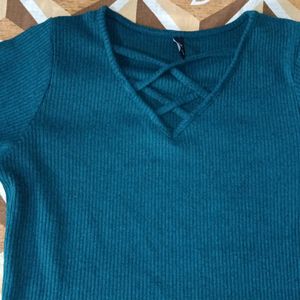 I am Selling A Dark Green Top .