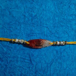 Resin Rakhi With Quote Made Of Roli And Chawal