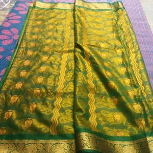 Green Saree With Golden Flowers Design