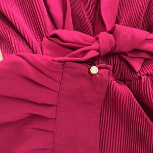 Pleated Peplum Top With Bow