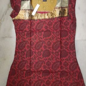 New kurti ....maroon colour printed pure cotton...cap sleeves...Round neck...no flaws...own factory made