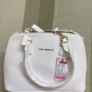 white hand bag