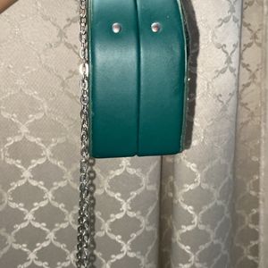 a sling bag with long chain ..nd clutch