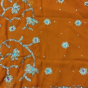 embroidered heavy orange saree