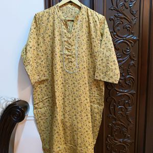 Yellow kurta with a delicate, small floral Print.