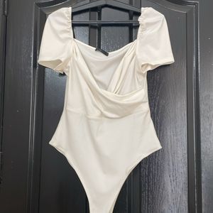 Sexy White low cut body suit