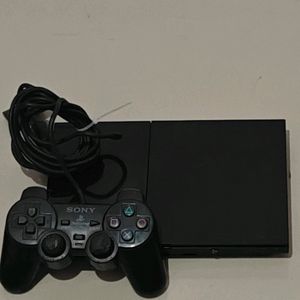 PS2 Console With 11 CD's (Non Working)