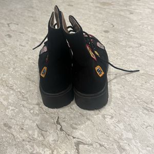 Black patch army boots