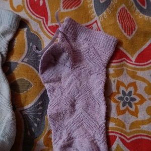 Two Pairs Of Baby Socks. Pink And Green