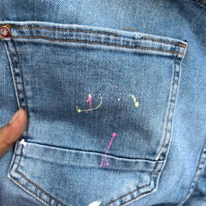 Zara ripped patches colour splash jeans