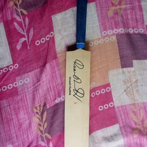 Cricket Bat With A Signature Of Dinesh Karthik