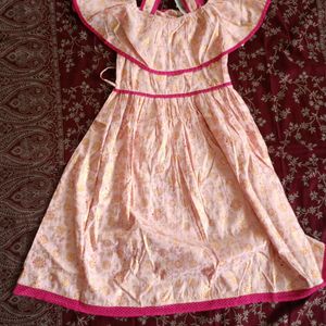 Baby Pink Frock With Gold Prints In It