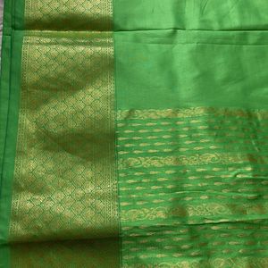 Green saree without blouse with zaree work