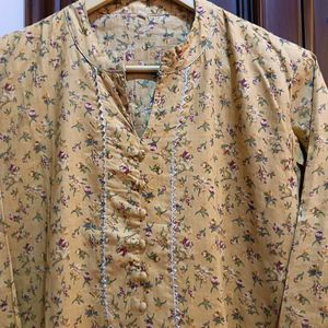 Yellow kurta with a delicate, small floral Print.