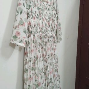 White Colour Printed Frill Type Gown. Eacy To Wear The Front Portion Is Frill Type And White Beeds Work Is Very Beautiful. Frill And Elastic Work So Medium And Xl Type People Can By. .