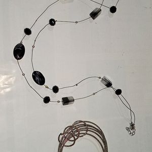 A Semi Black Neckpeice With Churi Bracelet.