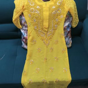 Yellow Chikankari Kurta And White Flared Palazzo