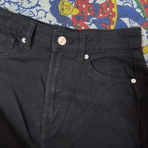 Black Flared Jeans With Cutout Detail