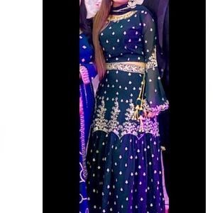 Dark Green Colored lehenga With Blouse And Duppata