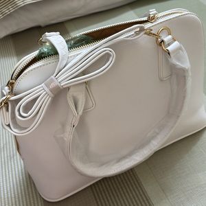 white hand bag